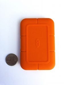 lacie rugged ssd next to quarter